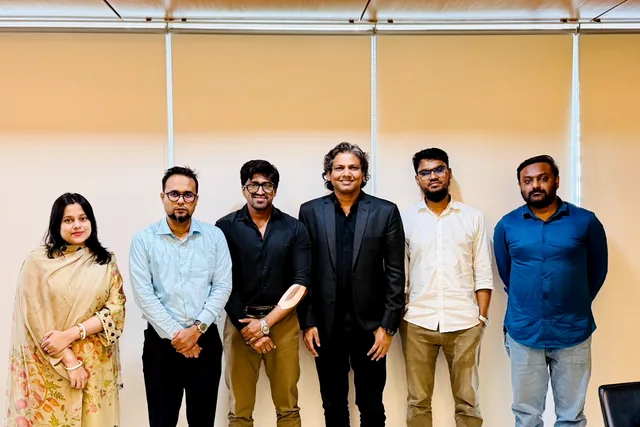 Tawfique Ahmed with colleagues at a team gathering