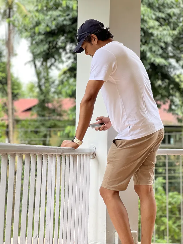 Tawfique Ahmed looking out from a shaded veranda