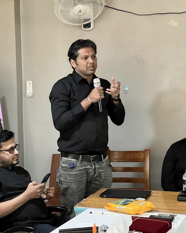 Tawfique Ahmed speaking with participants in a workshop